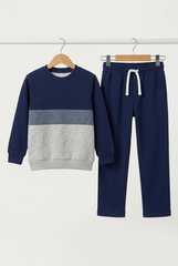 Co-ord set with the reference sweatshirt and relaxed navy trousers on separate hangers
