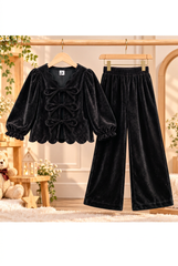 Black matte velvet outfit on separate wooden hangers