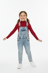 Denim dungarees styled with a red high-neck top