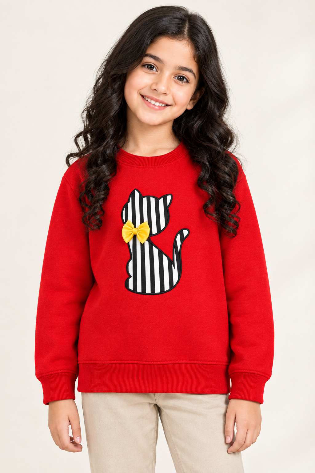Pakistani girl showcasing the red cat sweatshirt